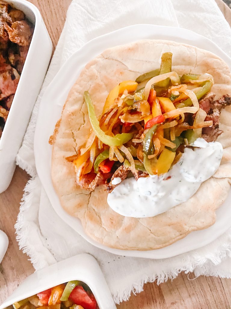 Steak Fajitas with Sautéed Bell Peppers and Lime Crema